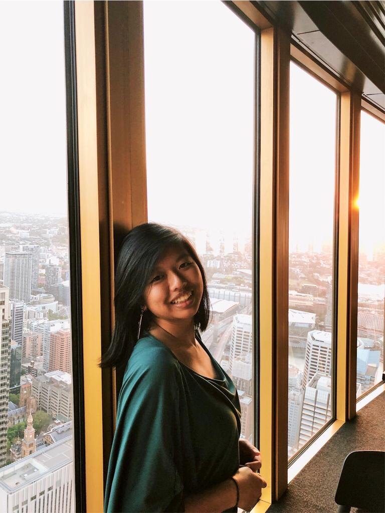 Carrie Tam by the window above the city