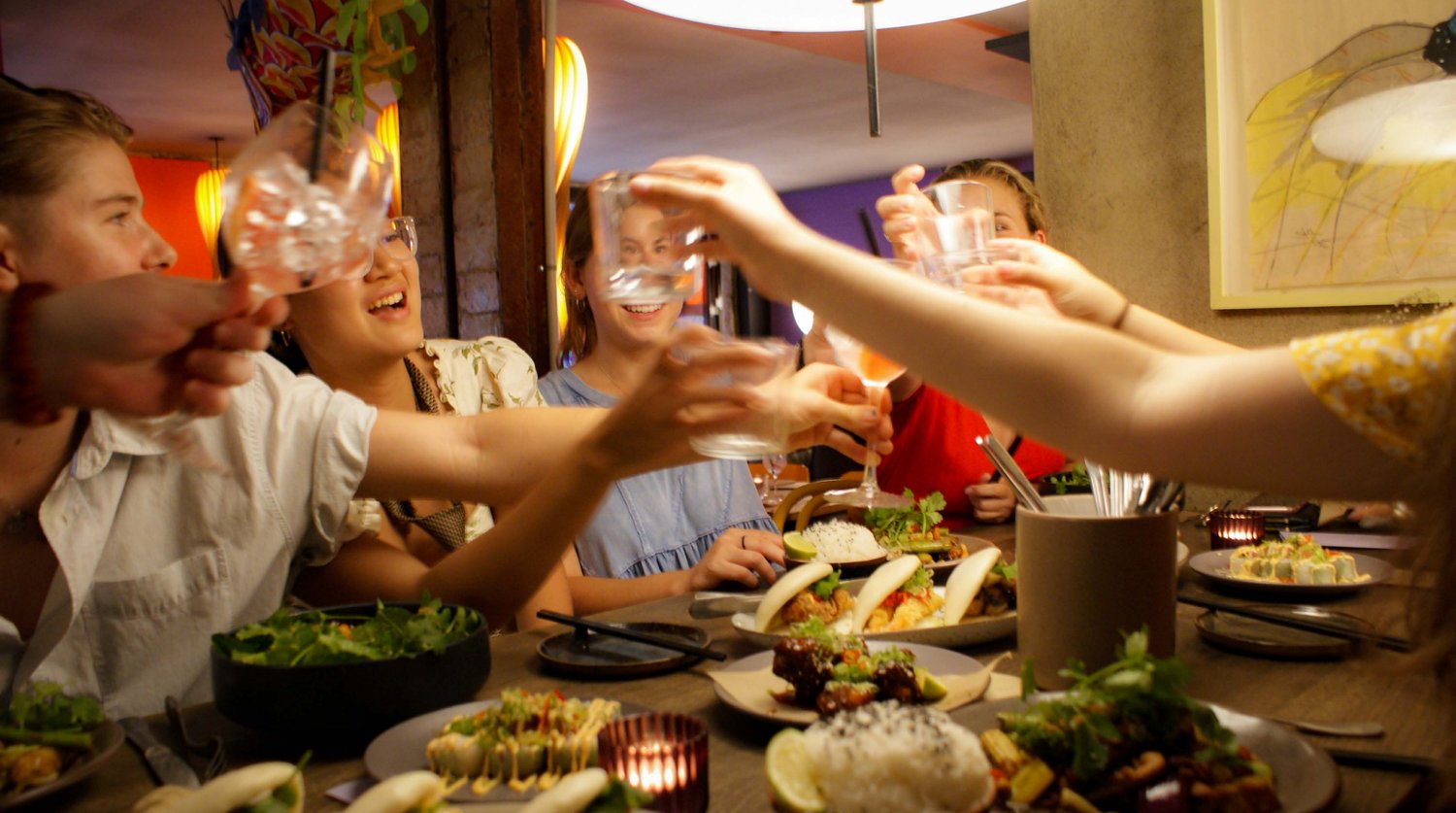 Friends toasting at dinner